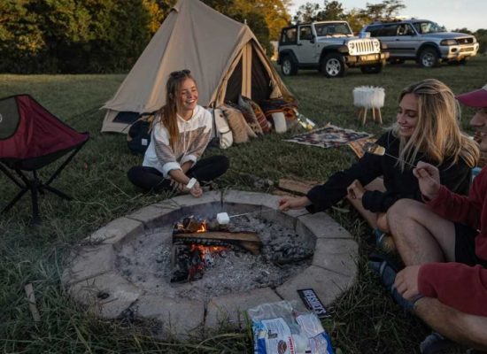 friends enjoying marshmallow on campfire